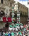 First torre de vuit amb folre and pilar de set amb folre descarregats simultaneously in human tower history, Castellers de Vilafranca, 31/08/2006
