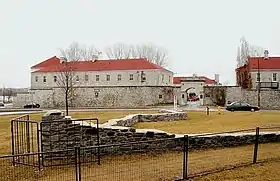 Remnants of the old fort with the new Fort Frontenac in background