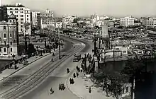 A large Japanese city with American soldiers patrolling the streets。