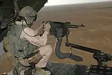 M240通用機槍 mounted on V-22 loading ramp with a view of Iraq landscape with the aircraft in flight
